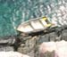 Dingy-Against-the-Rocks